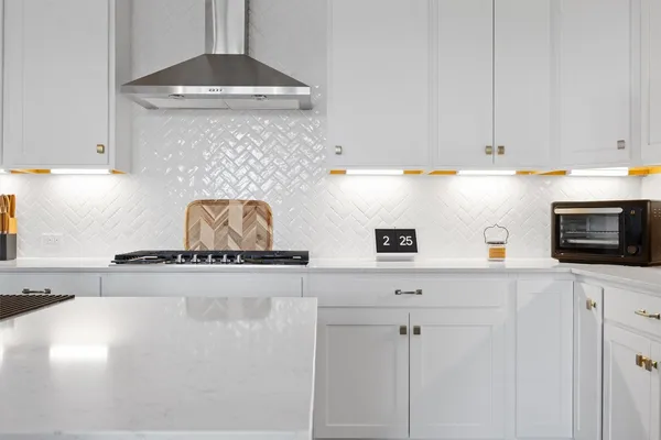 a kitchen with stainless steel appliances granite countertop a sink a stove and a granite counter tops