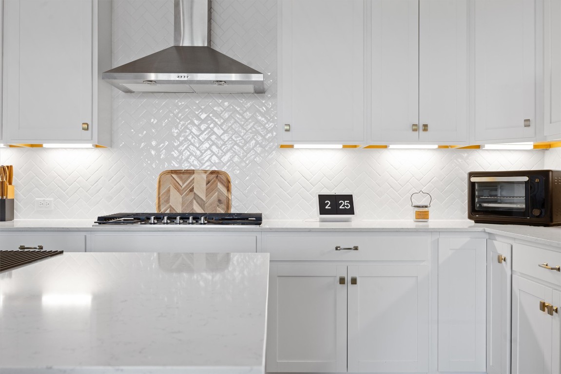 400 Turnbuckle Bend Leander, TX 78641 - Photo 14 of 40 a kitchen with stainless steel appliances granite countertop a sink a stove and a granite counter tops