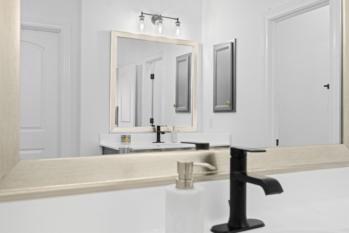 400 Turnbuckle Bend Leander, TX 78641 - Photo 18 of 40 a bathroom with a sink and a mirror