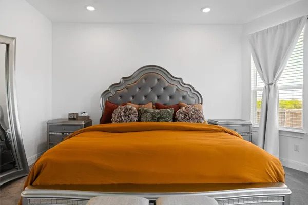 a bedroom with a bed and closet