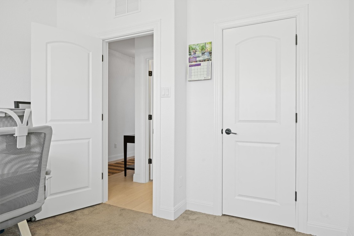400 Turnbuckle Bend Leander, TX 78641 - Photo 27 of 40 a view of a hallway with closet and a bathroom
