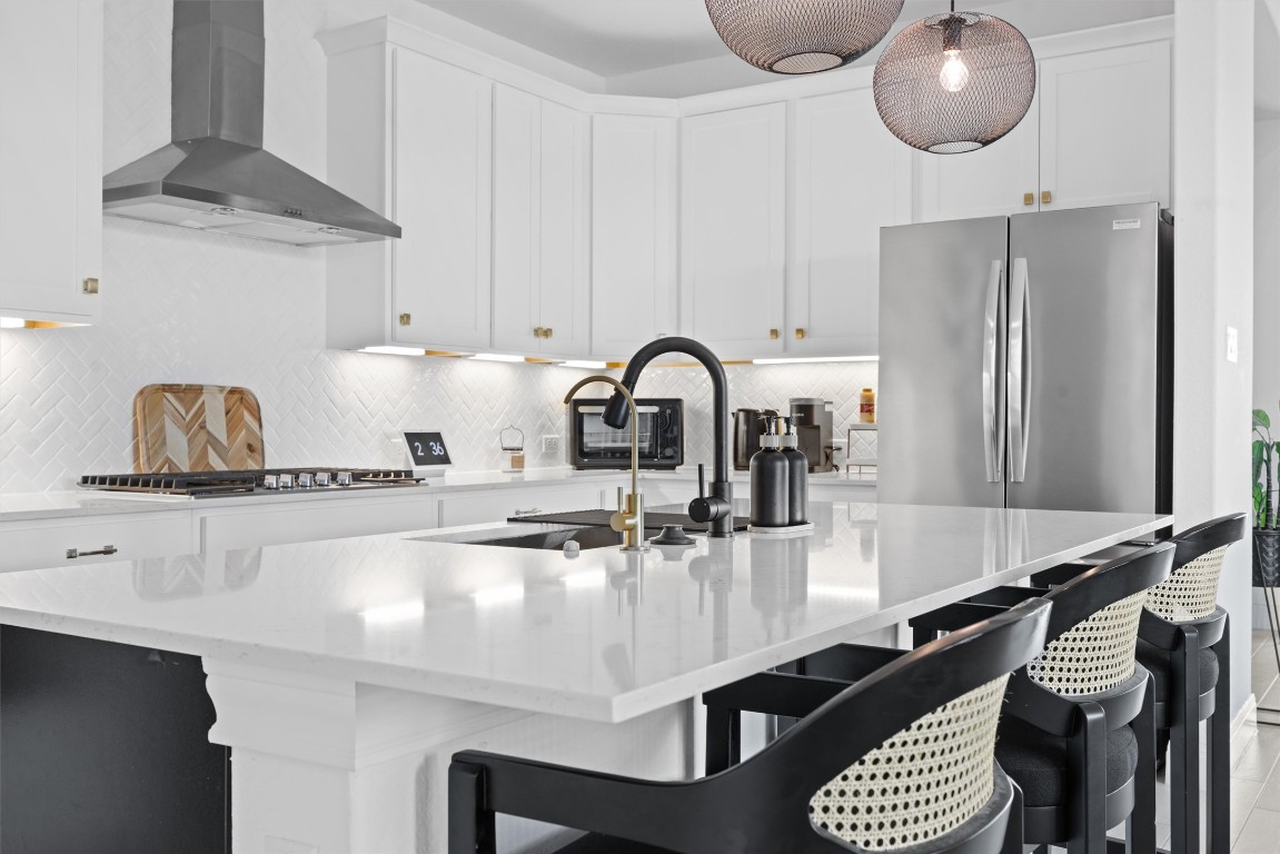 400 Turnbuckle Bend Leander, TX 78641 - Photo 28 of 40 a kitchen with a sink stainless steel appliances and cabinets