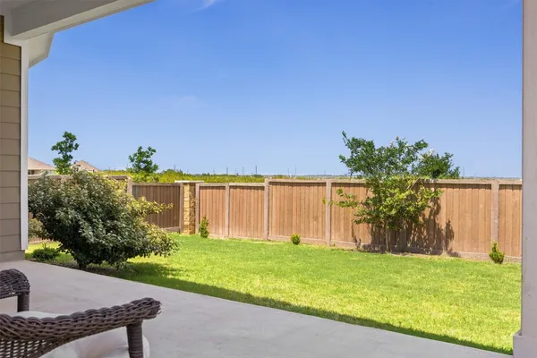 a view of a house with garden and porch