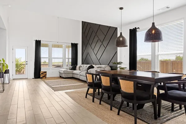 a view of a livingroom with furniture window and wooden floor