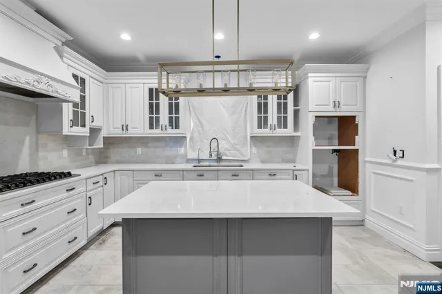 a kitchen with a sink and cabinets