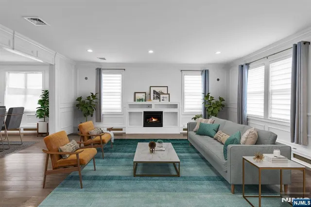 a living room with furniture fireplace and window