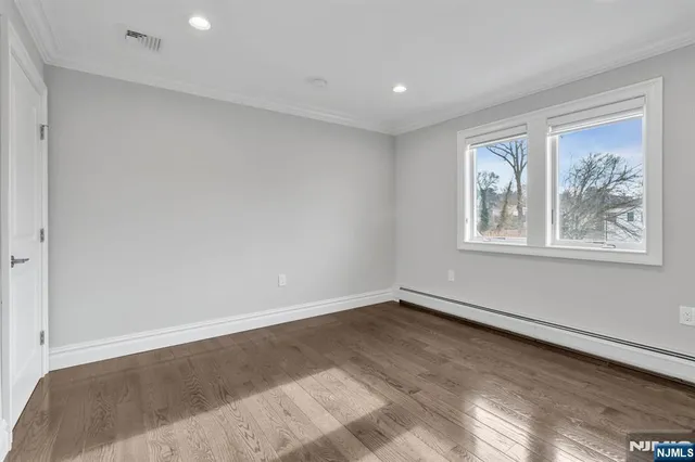 a bathroom with a granite countertop sink toilet and a mirror