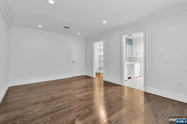 a bathroom with a double vanity sink mirror and shower