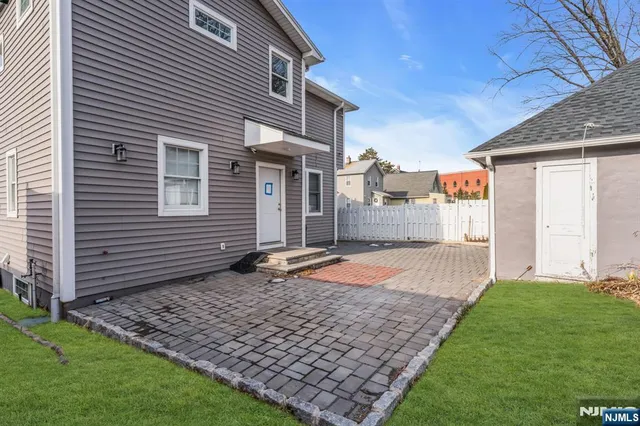 a view of backyard with a garden and plants