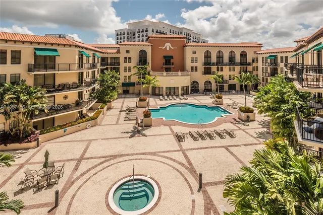 a front view of a building with outdoor seating