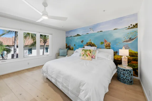 a bathroom with a double vanity sink a toilet and a bathtub