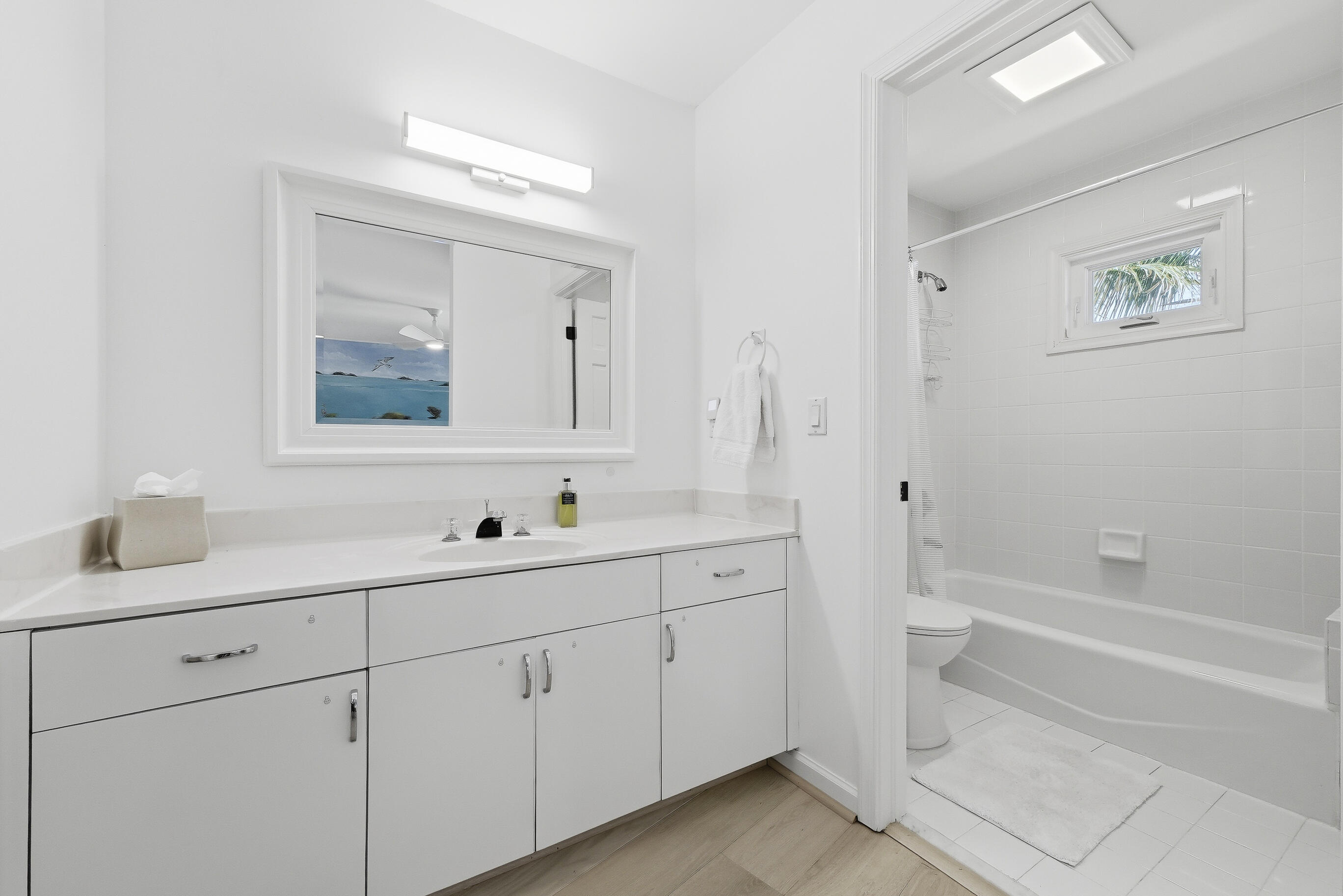 4535 Coquina Road Ocean Ridge, FL 33435 - Photo 23 of 45 a bathroom with a double vanity sink a toilet and a bathtub