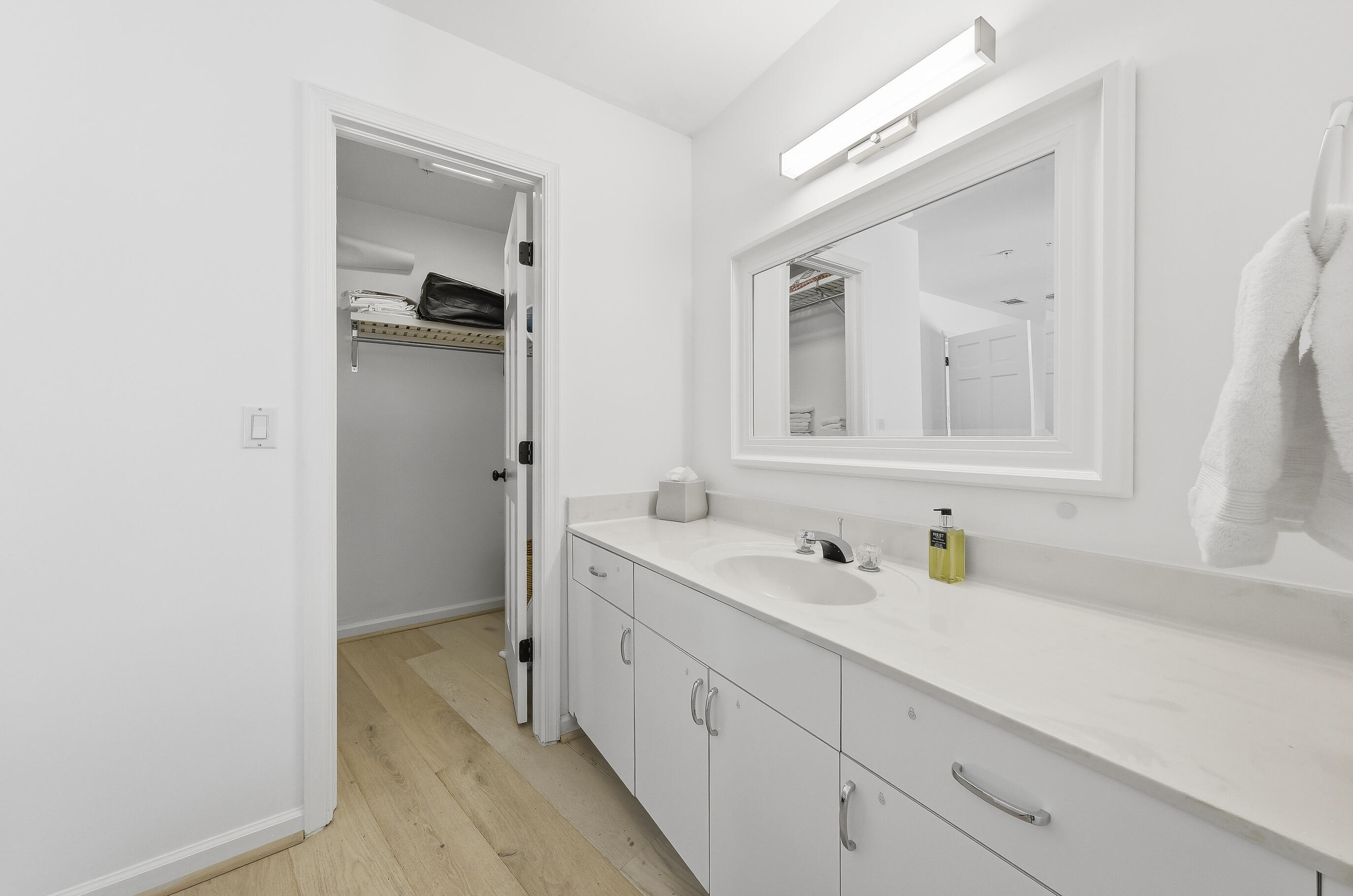 4535 Coquina Road Ocean Ridge, FL 33435 - Photo 25 of 45 a en suite bathroom with a sink and mirror