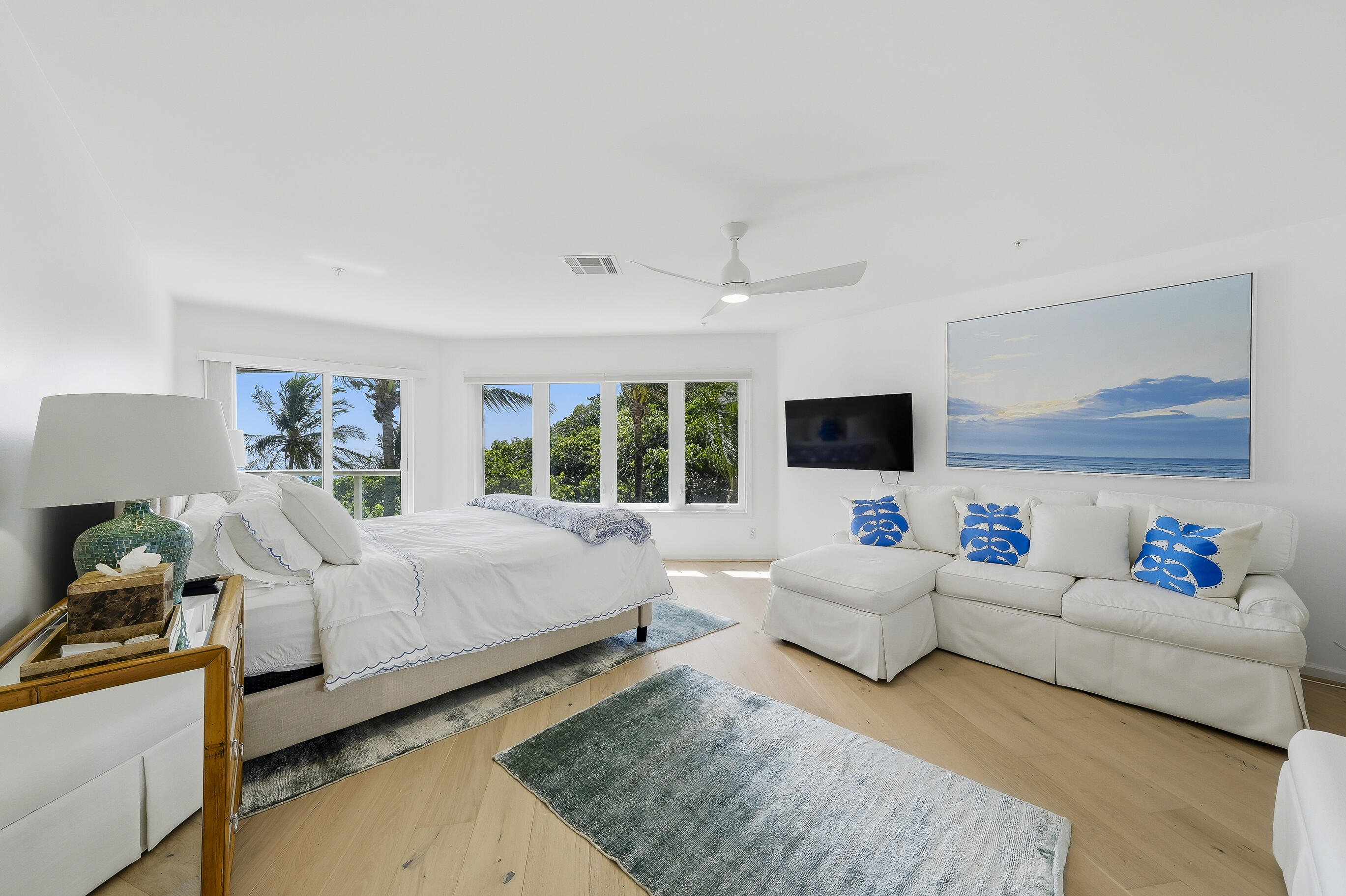 4535 Coquina Road Ocean Ridge, FL 33435 - Photo 26 of 45 a living room with furniture flat screen tv and a large window