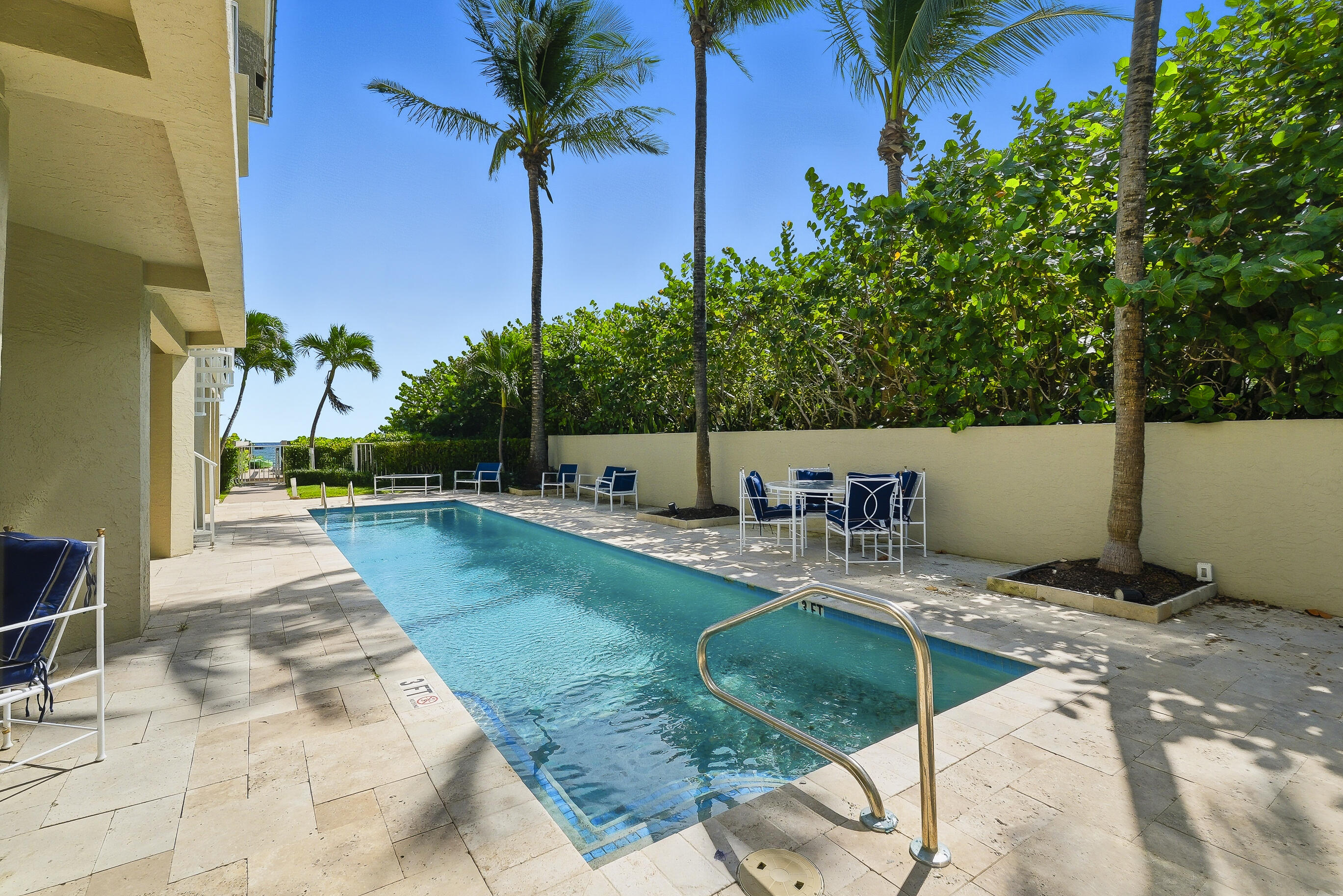 4535 Coquina Road Ocean Ridge, FL 33435 - Photo 33 of 45 a view of a swimming pool with a patio