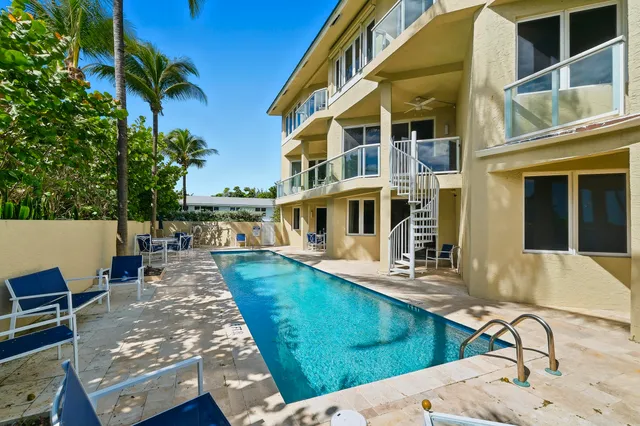 a view of a swimming pool with a patio
