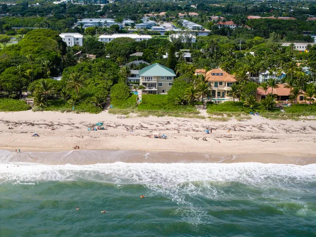 a view of a house with a yard balcony and sitting area