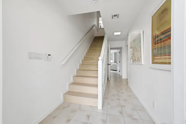 a view of entryway and hall with a window