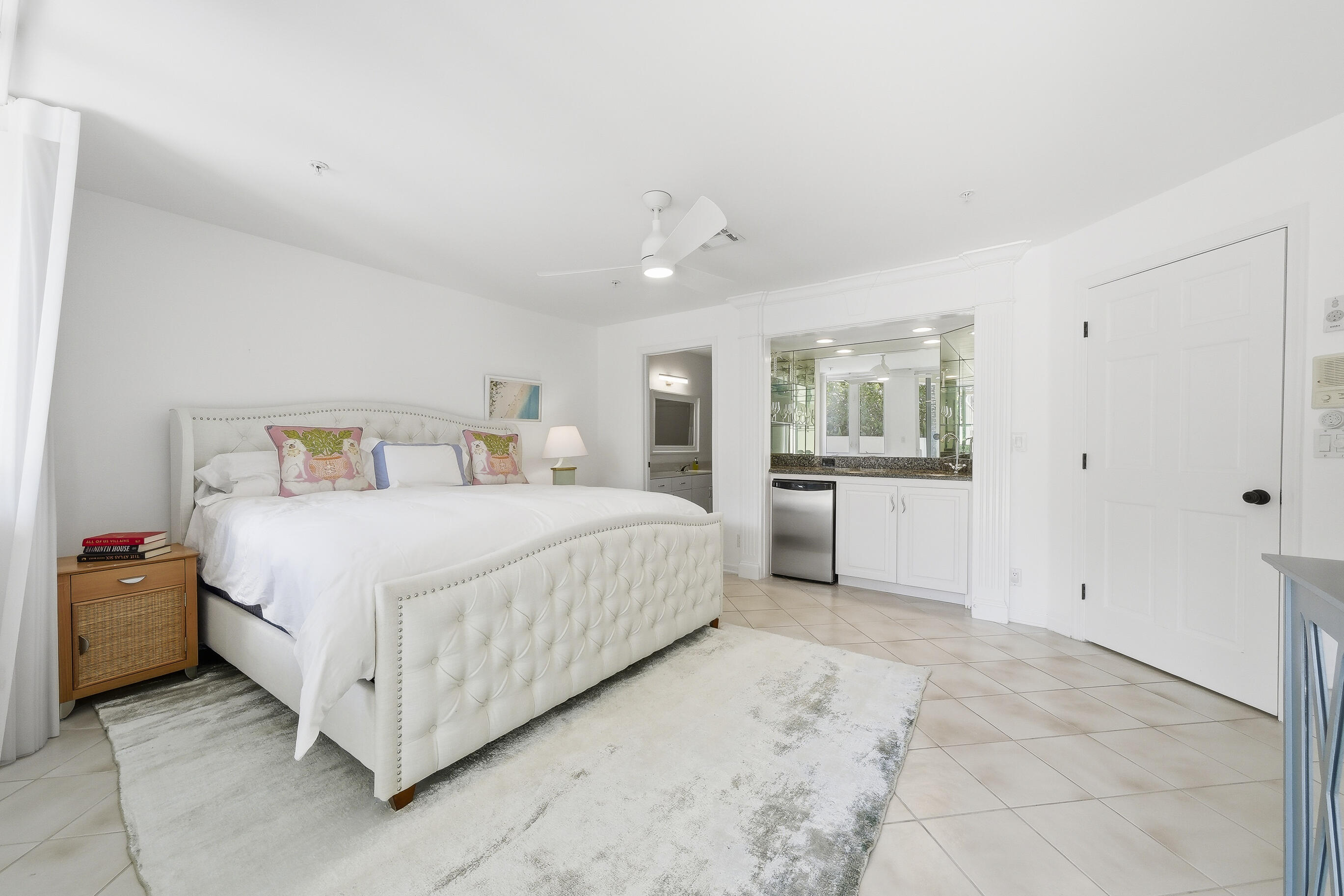 4535 Coquina Road Ocean Ridge, FL 33435 - Photo 6 of 45 a bedroom with a bed and a cabinets