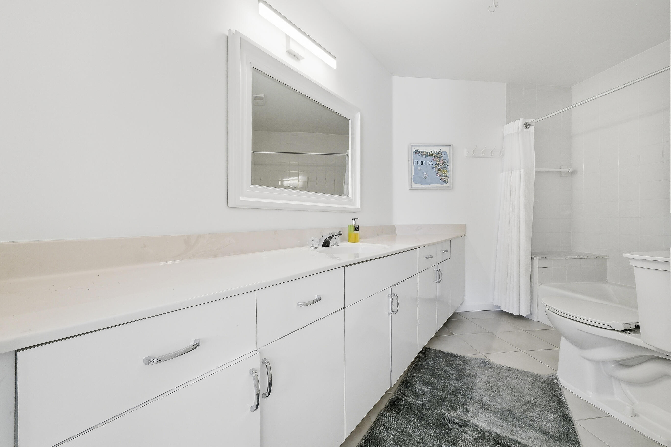 4535 Coquina Road Ocean Ridge, FL 33435 - Photo 7 of 45 a spacious bathroom with 2 sink and a bathtub