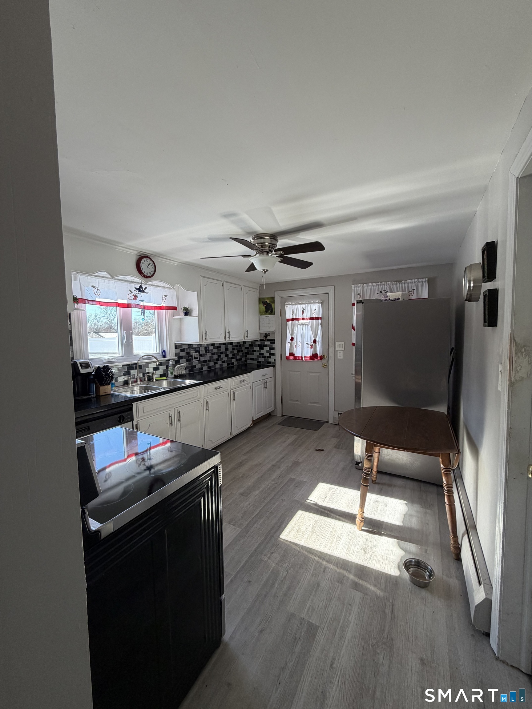 65 Cass Street Meriden, CT 06450 - Photo 14 of 21 a kitchen with granite countertop a stove and a refrigerator