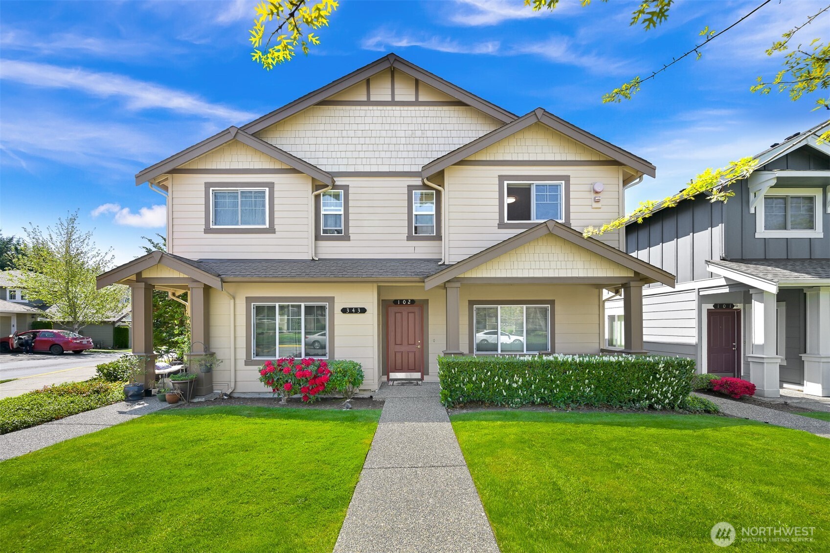 a front view of a house with garden