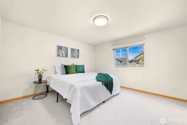 a bedroom with a bed and a table