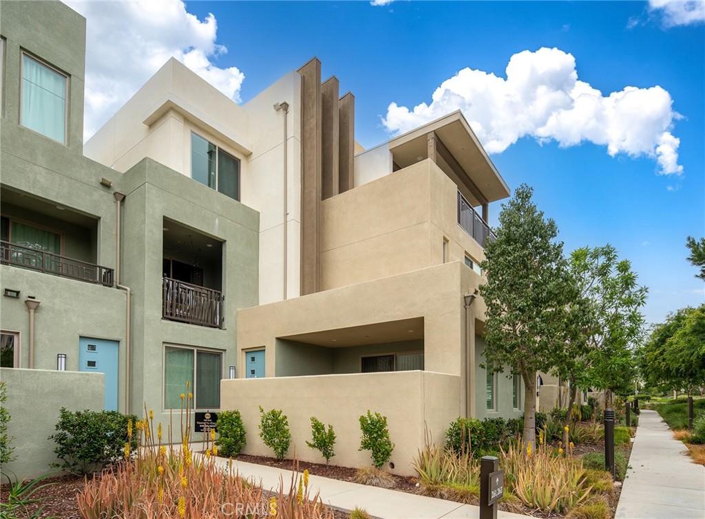 261 Magnet Irvine, CA 92618 - Photo 1 of 1 a front view of a house with a yard and seating space