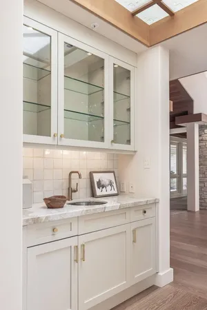 a kitchen with stainless steel appliances granite countertop a sink and cabinets