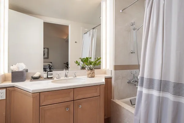a bedroom with a bed and dresser