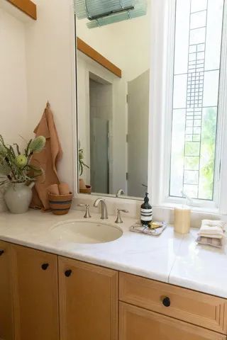 a living room with furniture a fireplace and a table