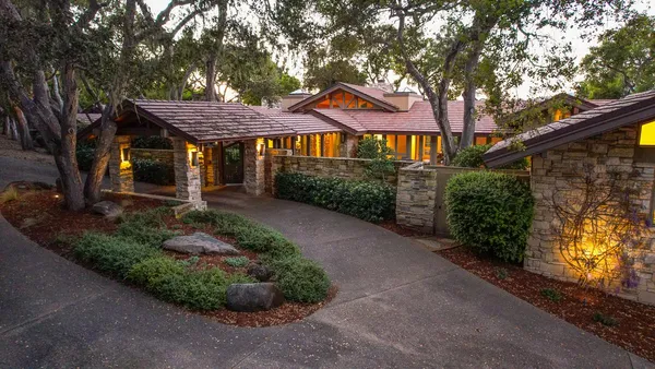 a front view of a house with garden