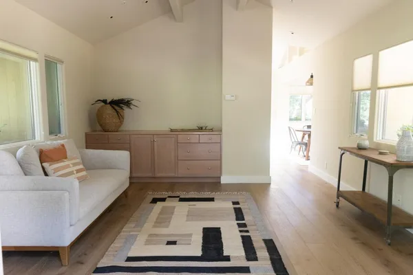 a kitchen with stainless steel appliances a stove a sink and a microwave