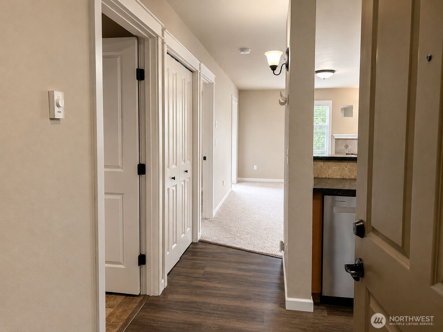 700 32nd Street, Unit A309 Bellingham, WA 98225 - Photo 3 of 28 a view of a hallway with wooden floor and entryway