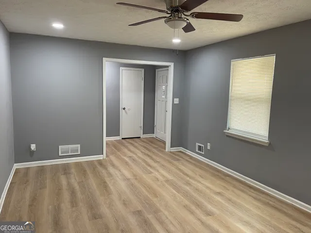 a view of an empty room with a window