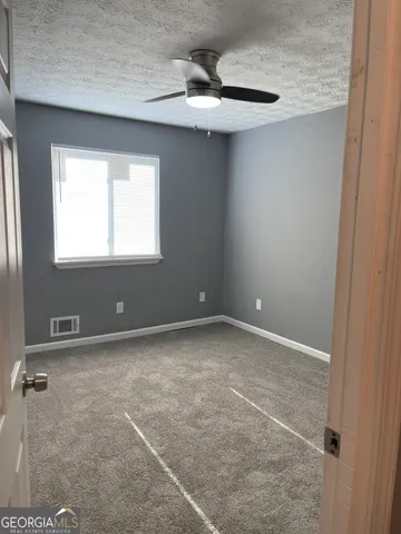a white toilet sitting next to a bath tub