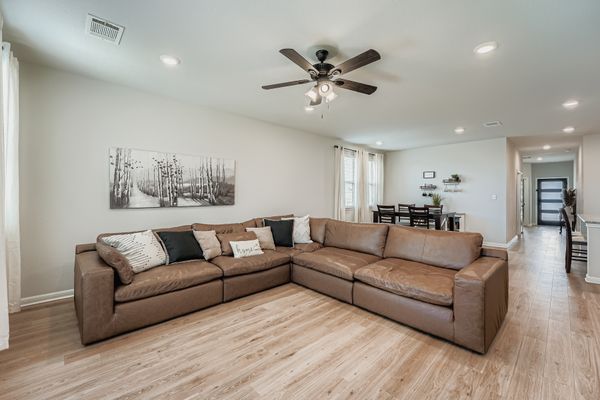 148 Gullivers Drive Elgin, TX 78621 - Photo 5 of 21 Living area with recessed lighting, ceiling fan, and light wood-style flooring