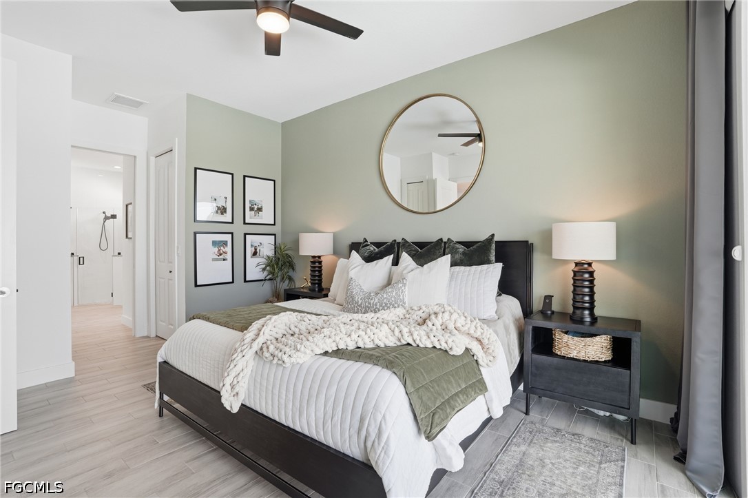 4635 Northwest 32nd Street Cape Coral, FL 33993 - Photo 11 of 30 a bedroom with bed and a chandelier