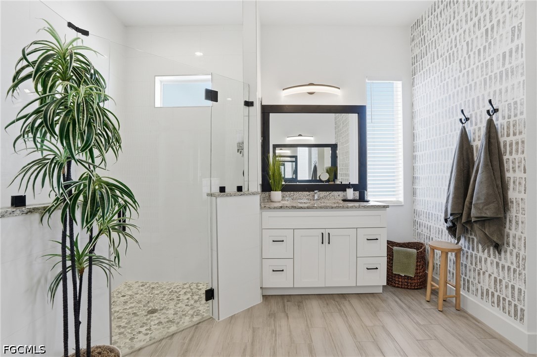 4635 Northwest 32nd Street Cape Coral, FL 33993 - Photo 13 of 30 a bathroom with a double vanity sink and a mirror