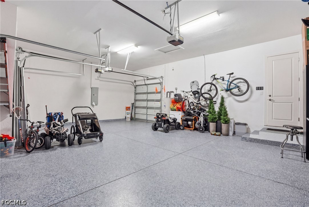 4635 Northwest 32nd Street Cape Coral, FL 33993 - Photo 23 of 30 a view of a garage with a bike and car