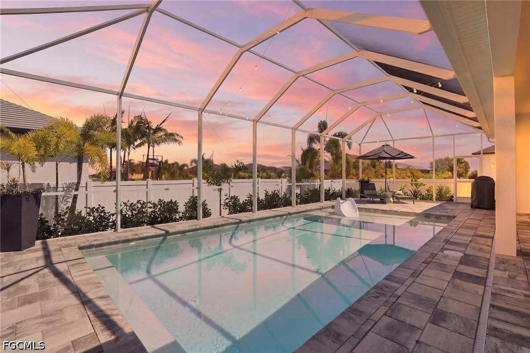 4635 Northwest 32nd Street Cape Coral, FL 33993 - Photo 24 of 30 a view of a swimming pool with a lounge chairs