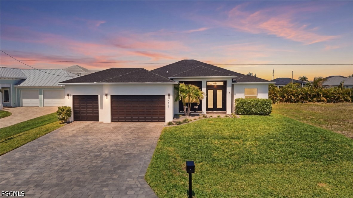 4635 Northwest 32nd Street Cape Coral, FL 33993 - Photo 30 of 30 a front view of a house with garden
