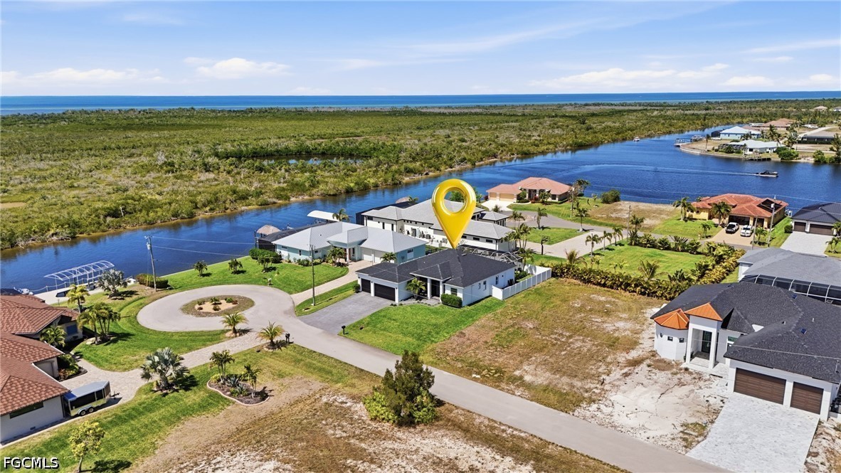 4635 Northwest 32nd Street Cape Coral, FL 33993 - Photo 4 of 30 an aerial view of a house with a ocean view