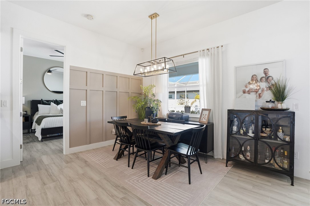 4635 Northwest 32nd Street Cape Coral, FL 33993 - Photo 8 of 30 a view of a dining room with furniture window and wooden floor