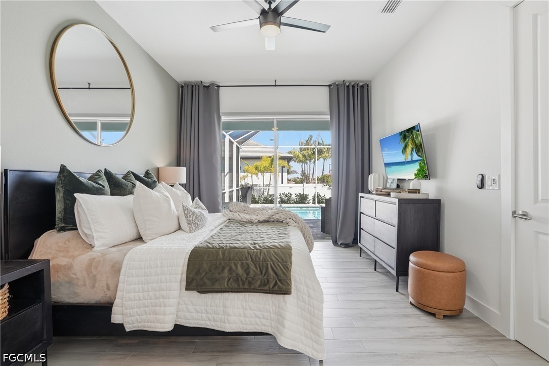 4635 Northwest 32nd Street Cape Coral, FL 33993 - Photo 9 of 30 a bedroom with bed and a large window