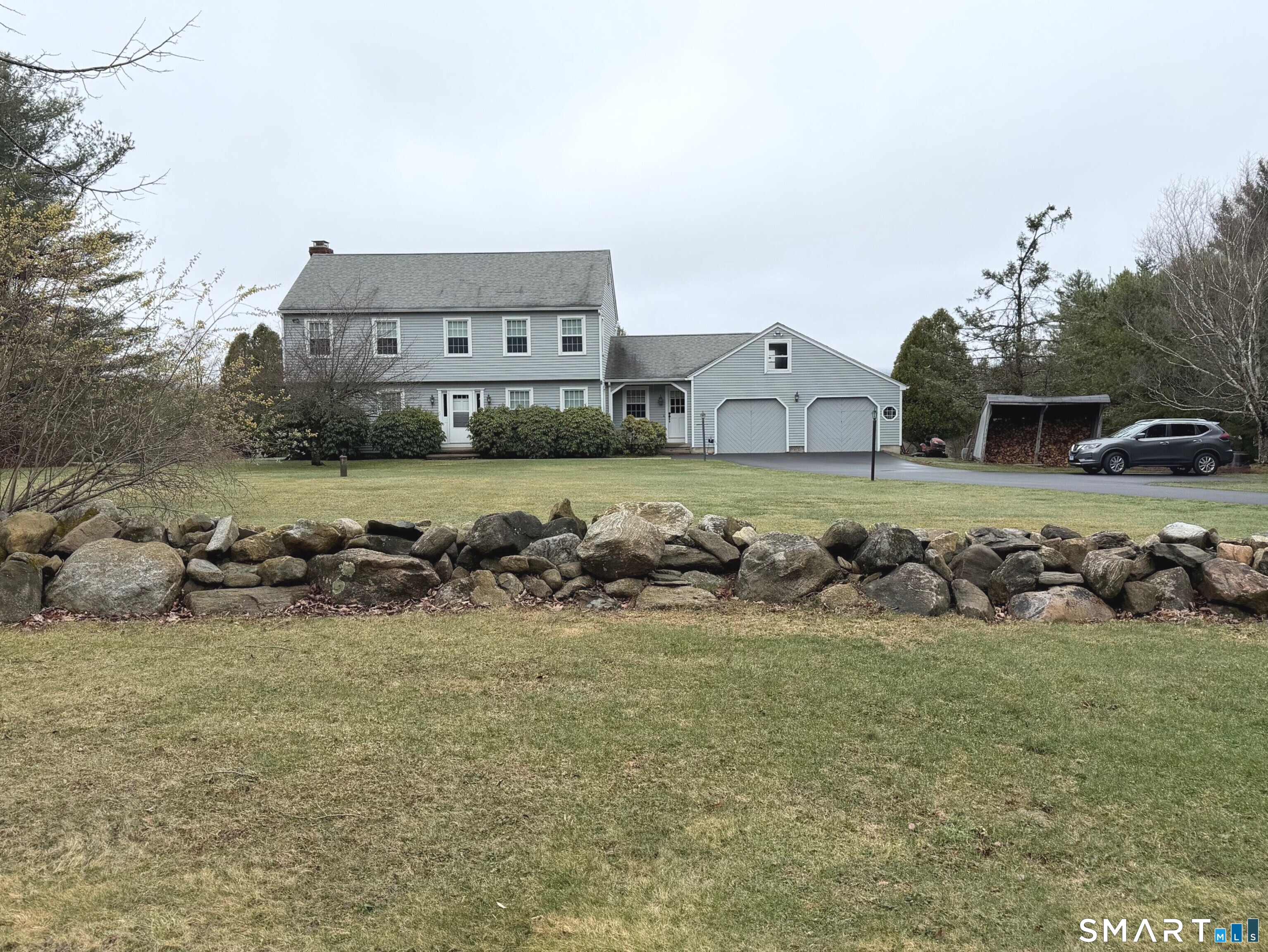 1833 Mountain Road Torrington, CT 06790 - Photo 1 of 2 Exterior Front with stone walls and 2 car garage