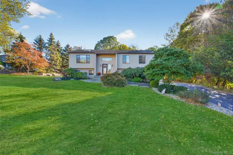 a view of a front of a house with a yard