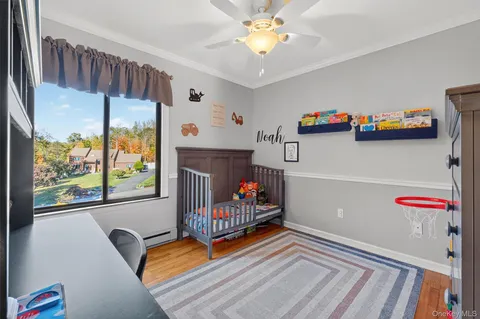 a bedroom with furniture and a window