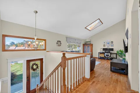 a view of a livingroom with furniture and staircase