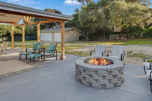 a view of a chairs and table in the patio